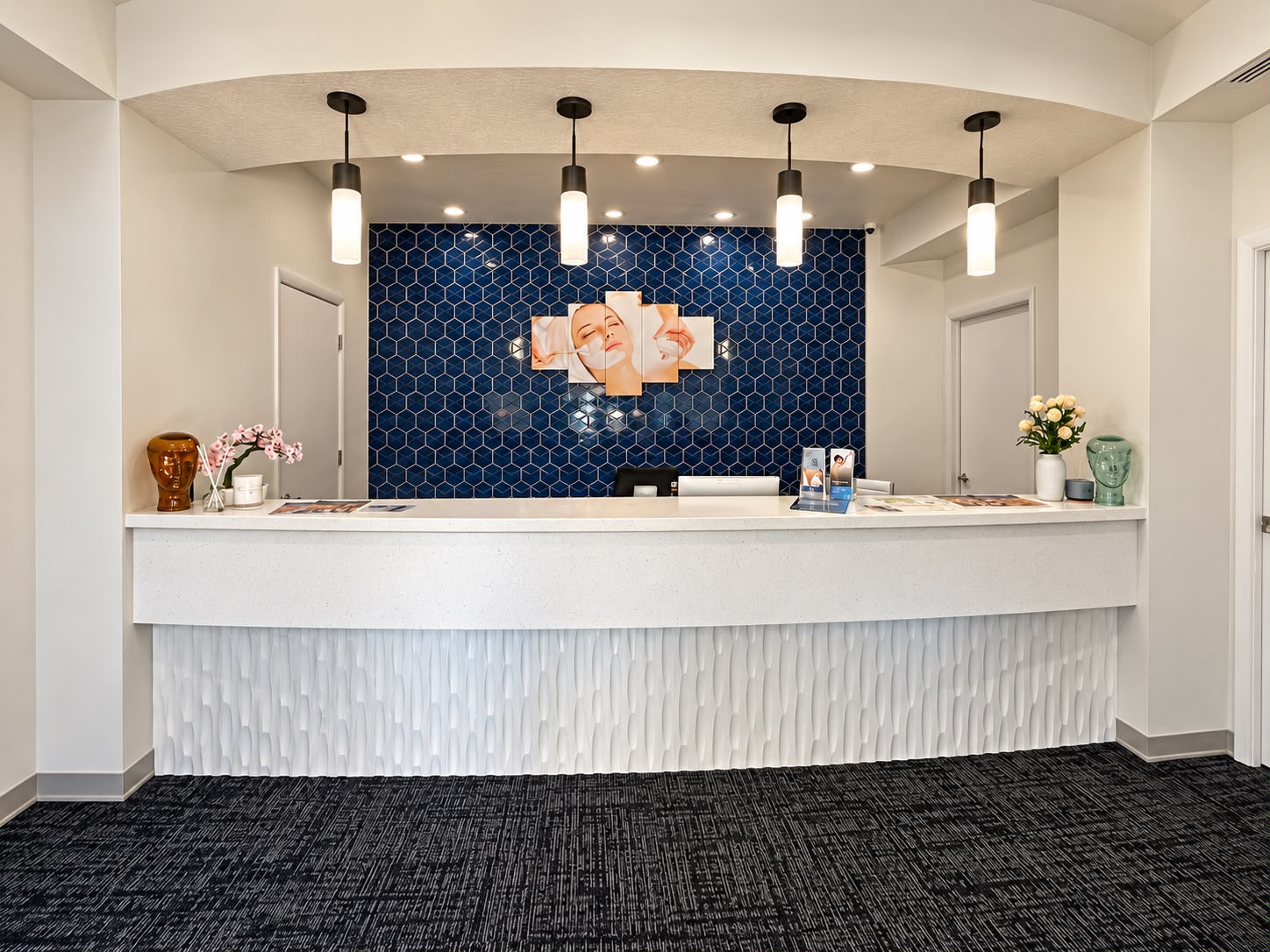 Medical spa reception with blue tile and white desk