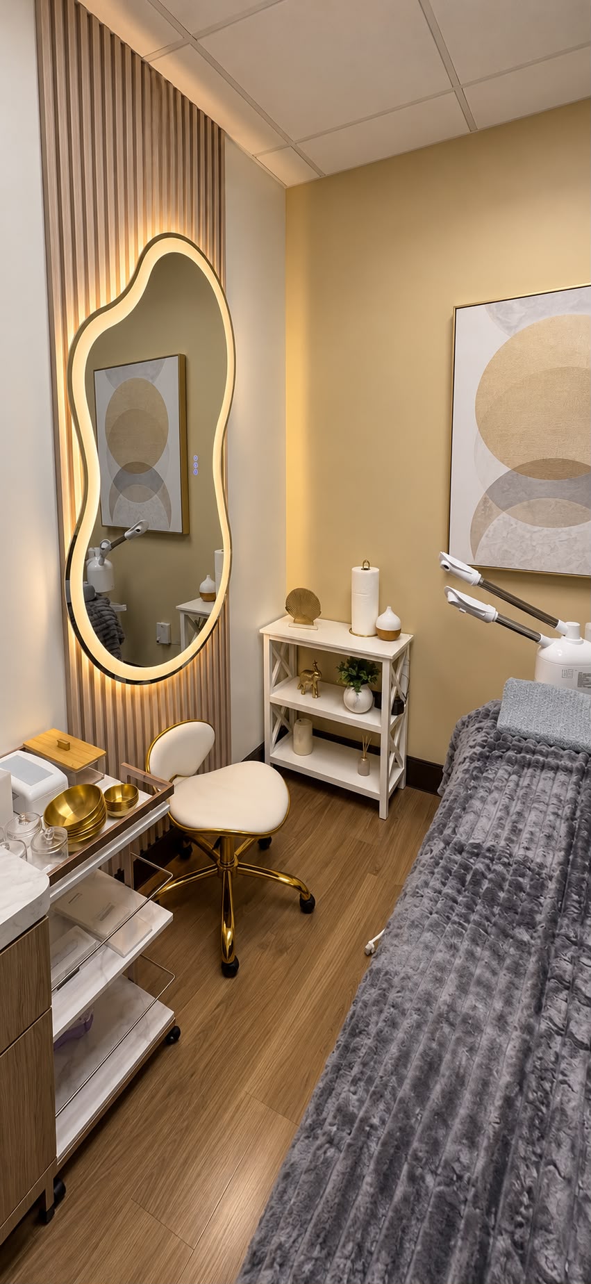 Treatment room with gold accents and spa bed