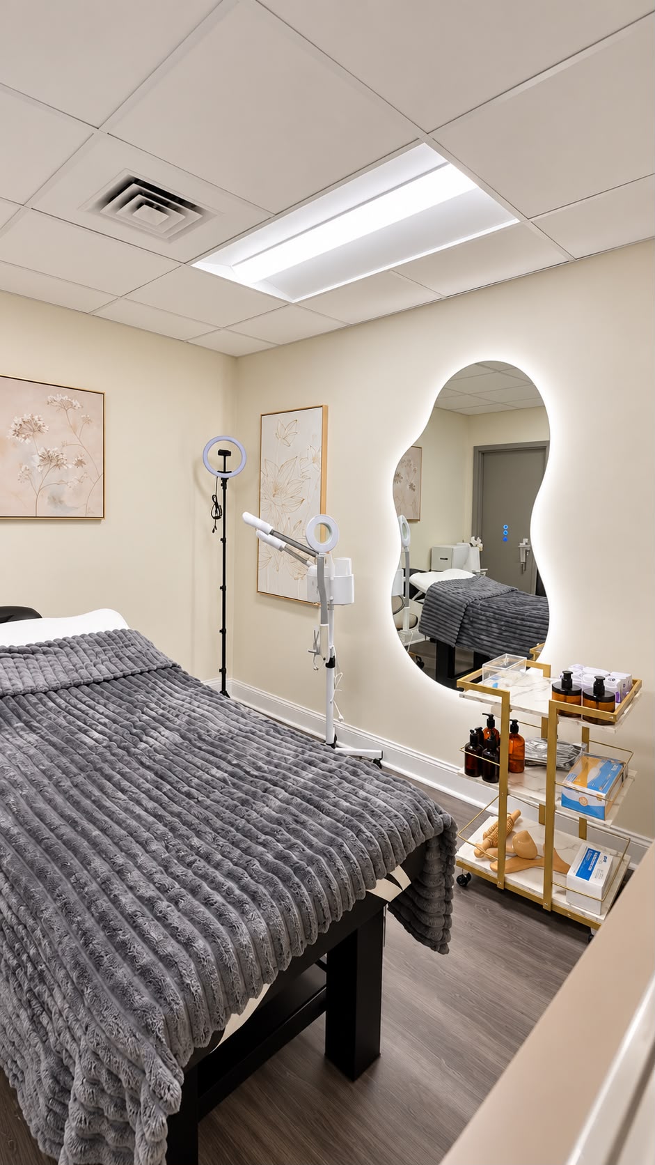 Private treatment room with vanity and spa bed